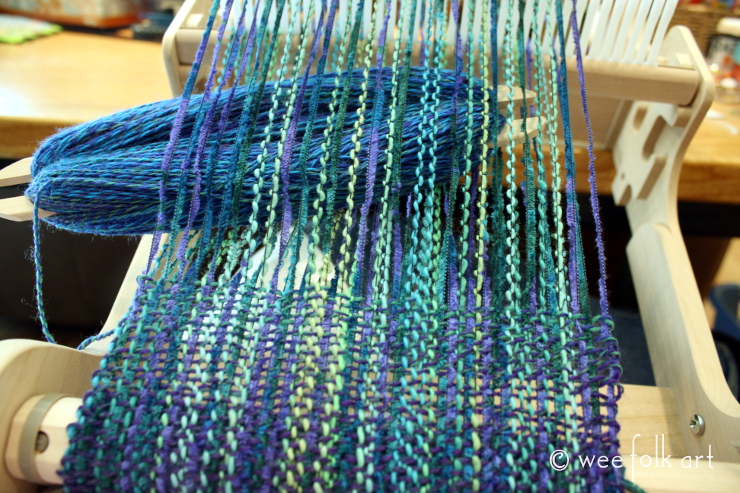 blue yarn on loom